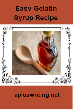 A bottle of gelatin syrup with a wooden spoon beside it