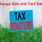 Yard sign saying garage sale and yard sale items are tax deductible