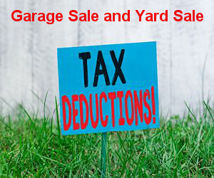 Yard sign saying garage sale and yard sale items are tax deductible