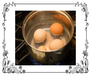 Eggs boiling in a pot of water
