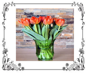 Orange tulips in a vase.