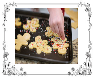 A cookie sheet with baked cookies being removed.