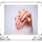 Hands gently folded showing healthy fingernails