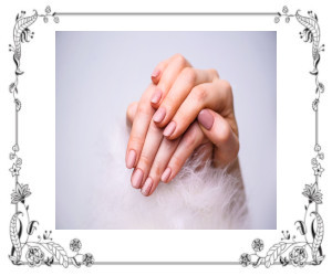 Hands gently folded showing healthy fingernails