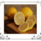 Whole lemons and slices on a cutting board