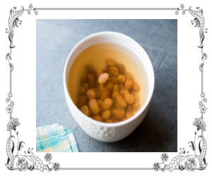 Bowl of golden raisins soaking in water